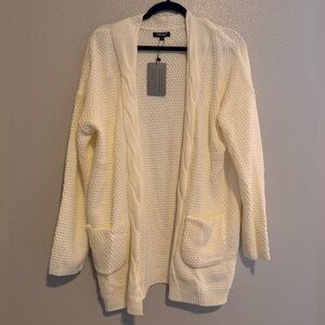 Cream cardigan, never worn. Oversized look.